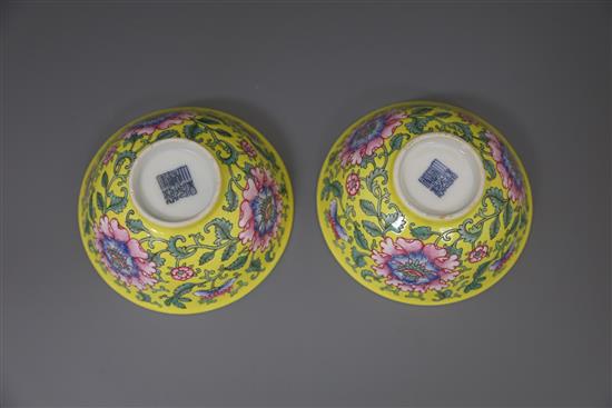 A pair of Chinese yellow ground famille rose bowls, Daoguang six character seal mark and probably of the period (1821-50), Diam.11.5cm